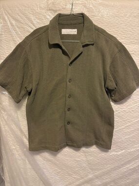 Zara’s Olive Green Knit Oversized Button-Up Shirt